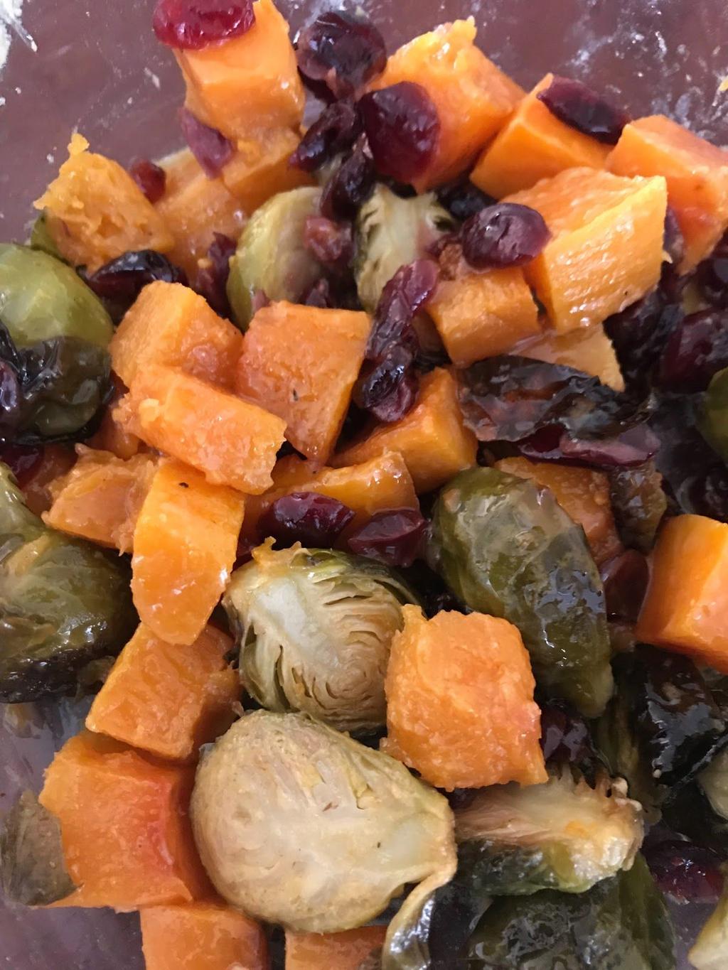 Butternut Squash, dried cranberry and brussel sprout side 1 Pound brussel sprouts, cut in half 1 Pound butternut squash, cut into cubes ¼ cup dried cranberries 4 tablespoons Olive oil 1 Tablespoon