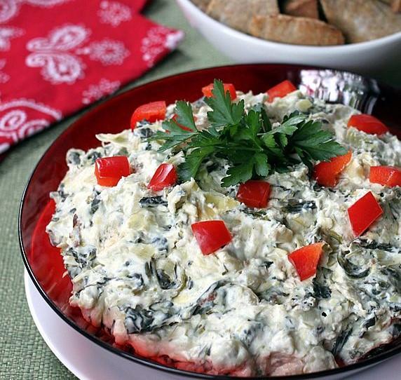 Healthy Spinach Artichoke Dip Slower Cooker or Oven 2 (14 oz) cans artichoke hearts, drained and coarsely chopped 1 (10 oz) package frozen spinach, thawed, drained and squeezed dry 1 cup shredded
