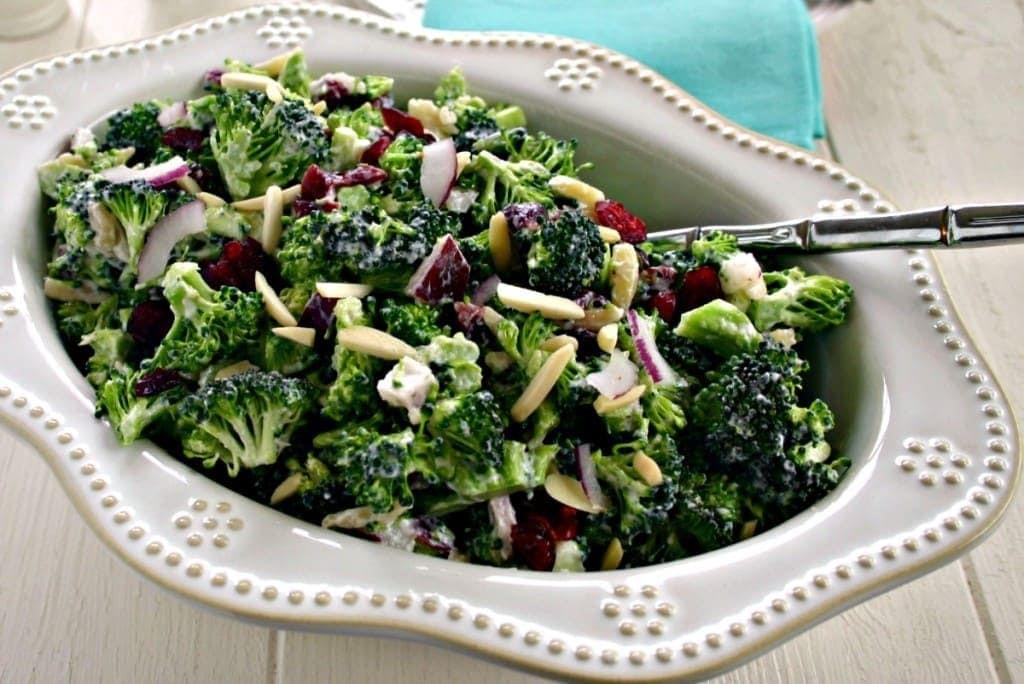 Lightened Up Broccoli Salad 4 cups coarsely chopped broccoli florets about 1 bunch 1/4 cup finely chopped red onion 1/3 cup slivered almonds 1/3 cup cranberries 1/3 cup light mayonnaise 3 tablespoons