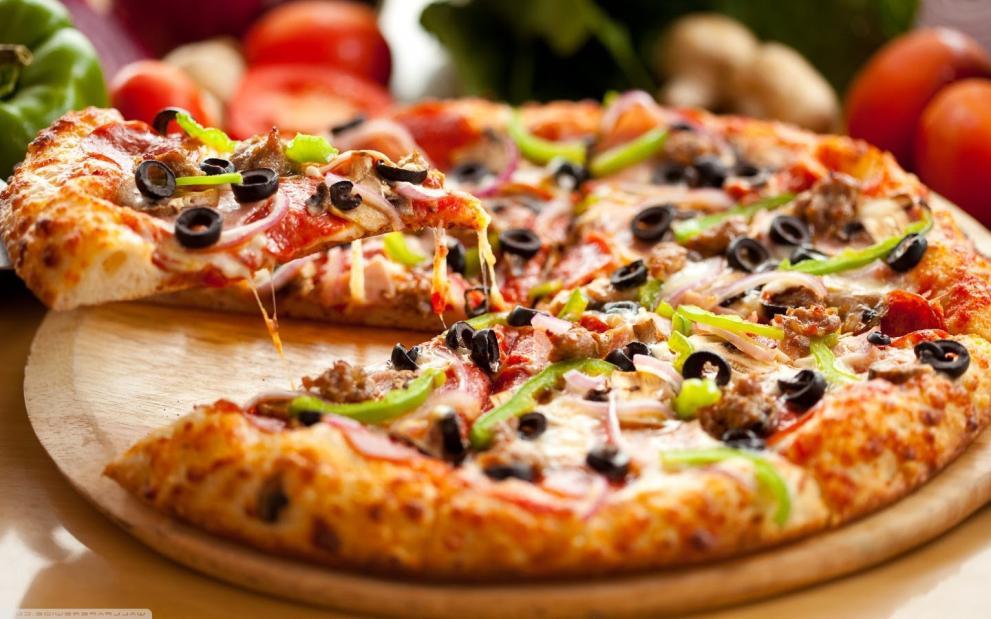 PIZZA In resturants, pizza can be baked in an oven with stone bricks above the heat source, an electric deck oven, a conveyor belt oven or, in the