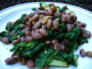 Greens and Beans Serves: 8 Serving Size: 1½ cups 1 cup of water 2 bunches greens (collards*, kale*, or escarole*), cleaned and cut up 2 tablespoons canola or olive oil 4 cloves garlic*, diced OR 1