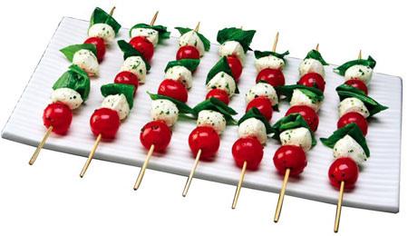 MOZZARELLA, CHERRY TOMATOES, & BASIL SKEWERS w/ Olive Oil 24 grape or cherry tomatoes, halved 24 fresh basil leaves 24 small balls fresh mozzarella cheese (often labeled bocconcini) 1/2 cup balsamic